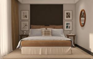 Ένα ή περισσότερα κρεβάτια σε δωμάτιο στο Hotel Madeira