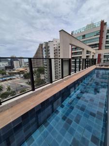 Бассейн в Studio Premium A7A - Recém Inaugurado, tudo novo или поблизости