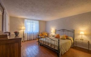 Postel nebo postele na pokoji v ubytování Villa Poggiostelle By Halldis + 30 fotografií