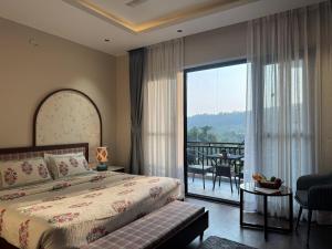 Ένα ή περισσότερα κρεβάτια σε δωμάτιο στο Saraiville- A Boutique Riverside Resort