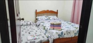 Postel nebo postele na pokoji v ubytování Happinest Transient Home