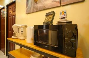 Kuchyň nebo kuchyňský kout v ubytování Happinest Transient Home