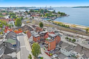 an aerial view of a town next to the water at Delikat, romslig og sjønær sentrumsleilighet in Larvik