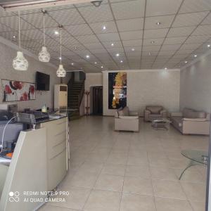 a large room with couches and a living room at Evim Butik Otel in Seyhan