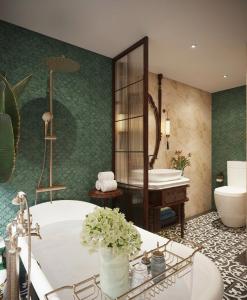 een badkamer met een bad, een wastafel en een spiegel bij Garden Legend 2 cruise in Ha Long