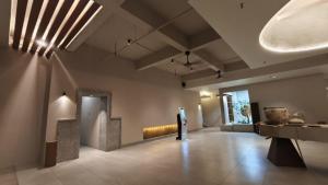 a large room with a museum with artifacts on the wall at Blanco Apartment Hotel in Bintulu +63 photos