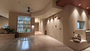 a large room with a hallway with a large window at Blanco Apartment Hotel in Bintulu