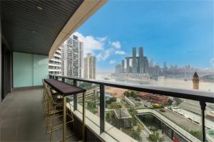 a balcony with a view of a city at Yunmu International Administrative Mansion Chongqing Nanbin Road Himalaya Branch in Nan'an
