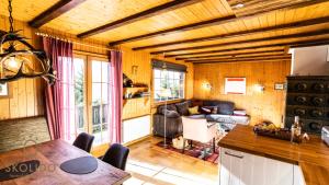 a living room with a couch and a table at Chalet Dorle, Riederalp Golmenegg in Riederalp