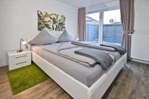 Ένα ή περισσότερα κρεβάτια σε δωμάτιο στο Ferienhaus Kattekerhuus