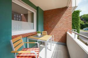 Balkón nebo terasa v ubytování Middenmang