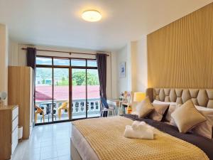 En eller flere senge i et værelse på 4 bedroom Lucky House Patong