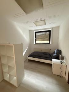 Ένα ή περισσότερα κρεβάτια σε δωμάτιο στο RO1 - Gepflegte Unterkunft Nahe Frankfurt