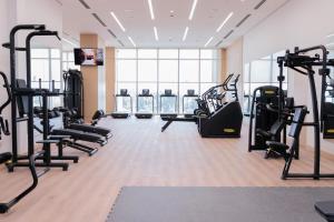 a gym with treadmills and elliptical machines at Crowne Plaza Dushanbe by IHG in Dushanbe +76 photos
