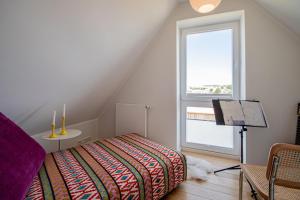 Ένα ή περισσότερα κρεβάτια σε δωμάτιο στο Ferienhaus Gröön Huus