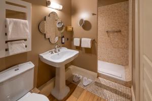 a bathroom with a sink and a toilet and a shower at Hotel Vendome - BW Signature Collection in Vendôme +97 photos