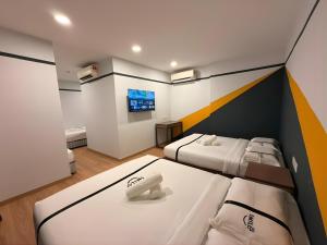 Postel nebo postele na pokoji v ubytování Smile Hotel The Mines Seri Kembangan