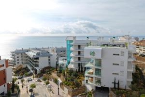 an aerial view of buildings and the ocean at Mara's Apartments Higuerón - Azzurro Med Two Collection - Seaviews in Fuengirola
