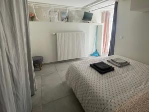 Postel nebo postele na pokoji v ubytování L'Escale Parisienne - à 25 min de paris - proche forêt