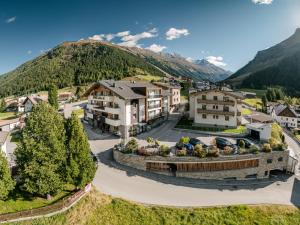 an aerial view of a resort with mountains in the background at Alpinhotel Monte Superior - Silvretta Card Premium Betrieb in Galtür