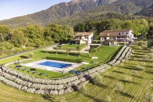 an aerial view of a house with a stone wall at Viola in Colico