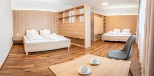 Ένα ή περισσότερα κρεβάτια σε δωμάτιο στο Krkonošský šarm