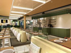 een restaurant met tafels en stoelen en een toonbank bij ibis Styles Béziers Centre in Béziers