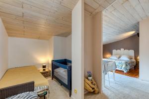 a bedroom with a bed and a desk in a room at Calmacé in Gignac