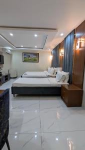 Ένα ή περισσότερα κρεβάτια σε δωμάτιο στο Hotel One