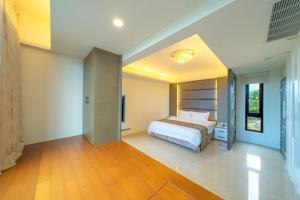 Postel nebo postele na pokoji v ubytování 蘭庭 Villa民宿 B&B + 39 fotografií