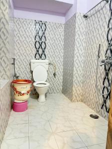 a bathroom with a toilet and a shower at Crown Plaza Heritage in Jodhpur