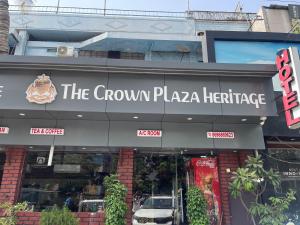 a building with a sign that reads the crown pizza heritage at Crown Plaza Heritage in Jodhpur