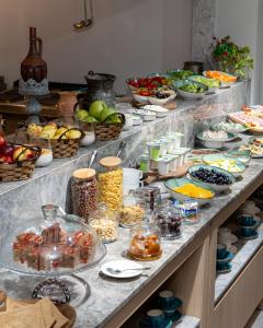 a buffet line with many different types of food at Central Square Hotel in Baku
