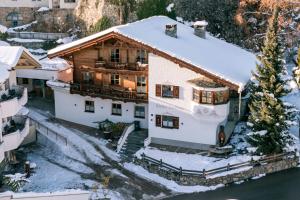 an aerial view of a house in the snow at Chalet LAUDEGG - Luxury Chalet with Private Spa in Ladis