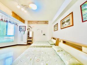 Ένα ή περισσότερα κρεβάτια σε δωμάτιο στο Lohas-artist B&B