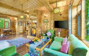 a living room with a couch and a fireplace at Storii By ITC Hotels Urvashis Retreat, Manali in Manāli