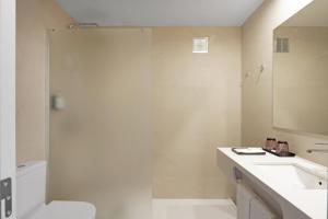 a bathroom with a toilet and a sink and a shower at Augusta Barcelona Vallès in Granollers