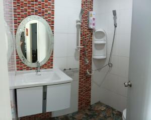 a bathroom with a sink and a mirror at 3BR Villa near Boat Avenue Laguna beach in Bang Tao Beach +44 photos