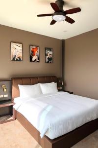 Ένα ή περισσότερα κρεβάτια σε δωμάτιο στο Me hotel