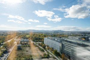 an aerial view of a city with buildings at Luxury City Apartment with Skyline View in Vienna