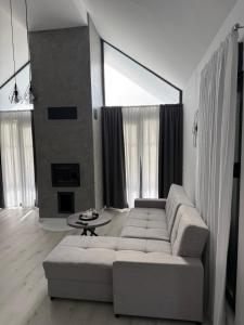 a living room with a couch and a table at Kuća za odmor Stubaki in Stubicke Toplice