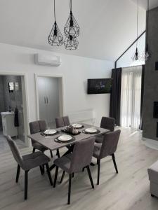 a dining table and chairs in a living room at Kuća za odmor Stubaki in Stubicke Toplice