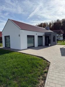 a white building with a driveway in front of it at Kuća za odmor Stubaki in Stubicke Toplice