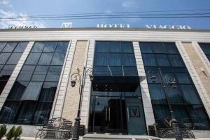 a large building with the entrance to a harry watson at VIAGGIO Yerevan in Yerevan