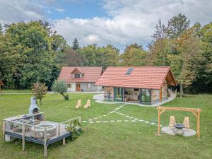 an aerial view of a house with a playground at Vineyard cottage Pri mali luži in Trebelno
