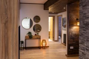 a hallway of a house with a table and a mirror at New Gudauri Ski4Life in Gudauri