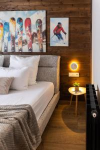 a bedroom with a bed with skis on the wall at New Gudauri Ski4Life in Gudauri