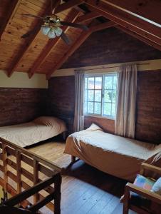 Voodi või voodid majutusasutuse Cabañas Rayun toas +9 fotot