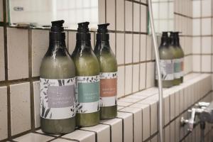 a row of wine bottles sitting on a shelf at Fuji Elegance Hotel in Yamanakako