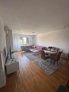 a living room with a couch and a table at Apartman IsTar View in Sarajevo